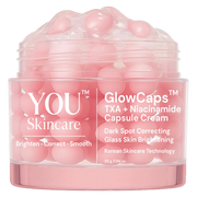 Pink skincare product container with visible text on a white background