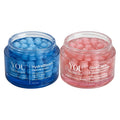 Two open cosmetic jars on a light gray background: a blue jar labeled YOU Skincare HydraBloom Capsule Cream and a pink jar labeled YOU Skincare GlowCaps TXA + Microneedle Capsule Cream, each filled with round gel capsules.