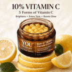 A jar of YOU Skincare Radi-C™ BOBA Capsule Cream with visible golden vitamin capsules inside, styled on stacked lemon slices with whole and sliced lemons and green leaves around it. Large text at the top reads '10% VITAMIN C' and '5 Forms of Vitamin C' with benefits listed below.