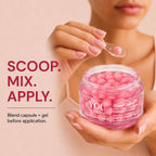 A close-up of a person holding an open jar of pink glow capsules and gel cream, with a small spoon holding one capsule above the jar. Text on the left reads 'SCOOP.