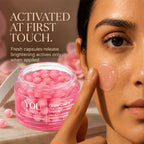 A close-up beauty ad showing a woman applying a pink gel cream from a clear jar labeled You Skincare GlowCaps. Large text reads 'ACTIVATED AT FIRST TOUCH.