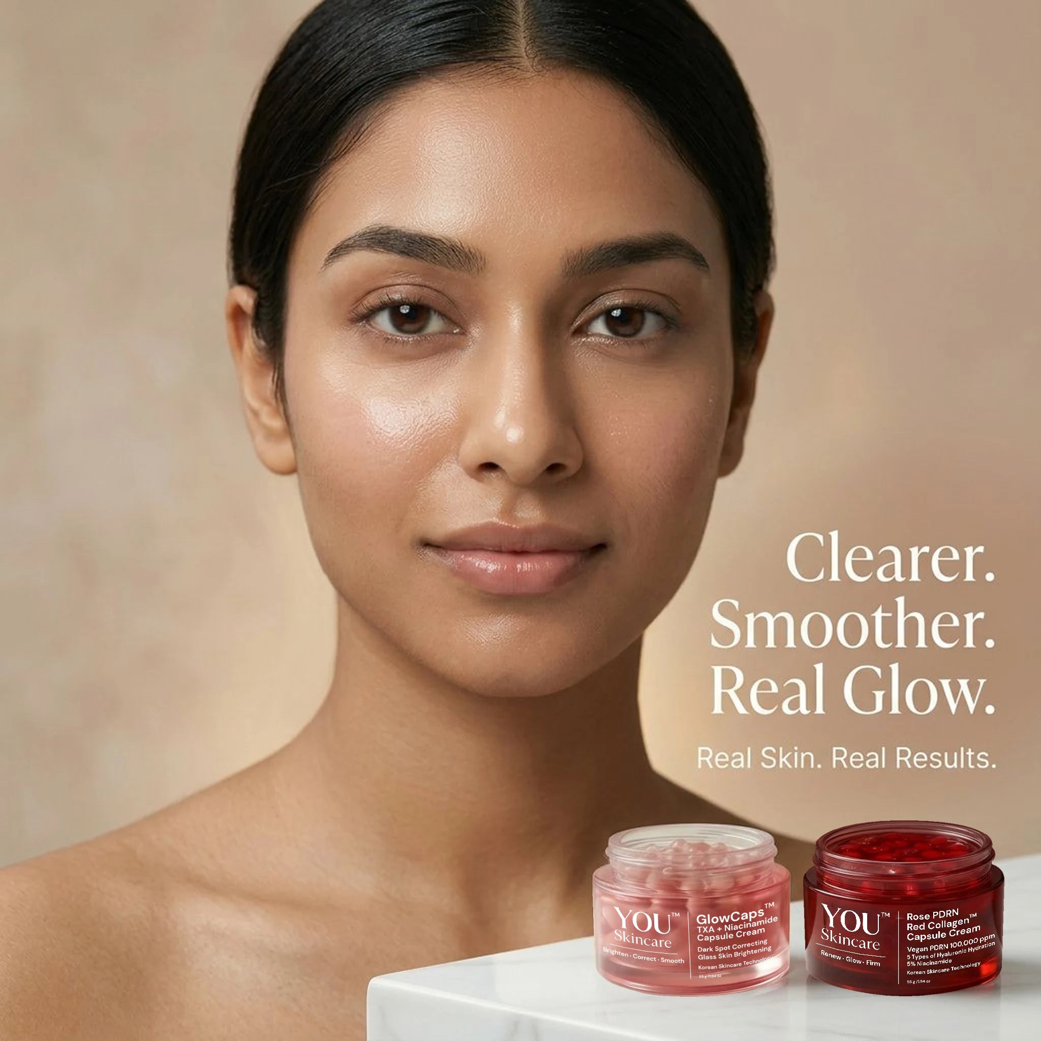 Woman with clear skin holding skincare jars with text 'Clearer. Smoother. Real Glow.'