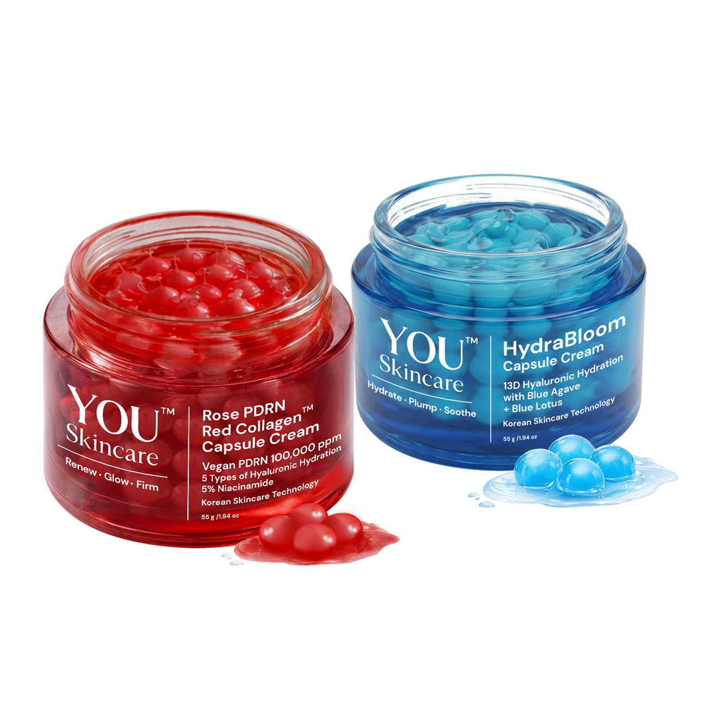 Two jars of YOU Skincare cream, one red and one blue, on a white background.