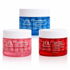 Three cosmetic cream jars from YOU Skincare on a white background: a blue HydraBloom Capsule Cream jar in the back, and two red/pink GlowCaps and Rose PDRN Red Collagen Capsule Cream jars in the front.