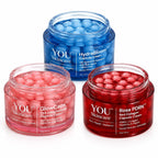 Three open cosmetic capsule jars on a white background: a blue jar labeled HydraBloom Capsule Cream in the back, and two pink/red jars in front labeled GlowCaps and Rose PDRN capsules.
